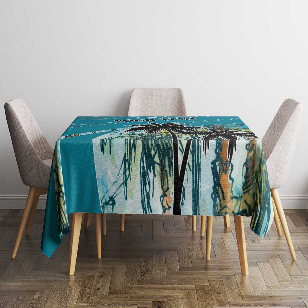 Blue tablecloth with tropical palm leaf print, rectangular cloth on dining table