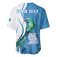 Personalized blue-and-white baseball jersey with quetzal bird graphic and 'Your Text'