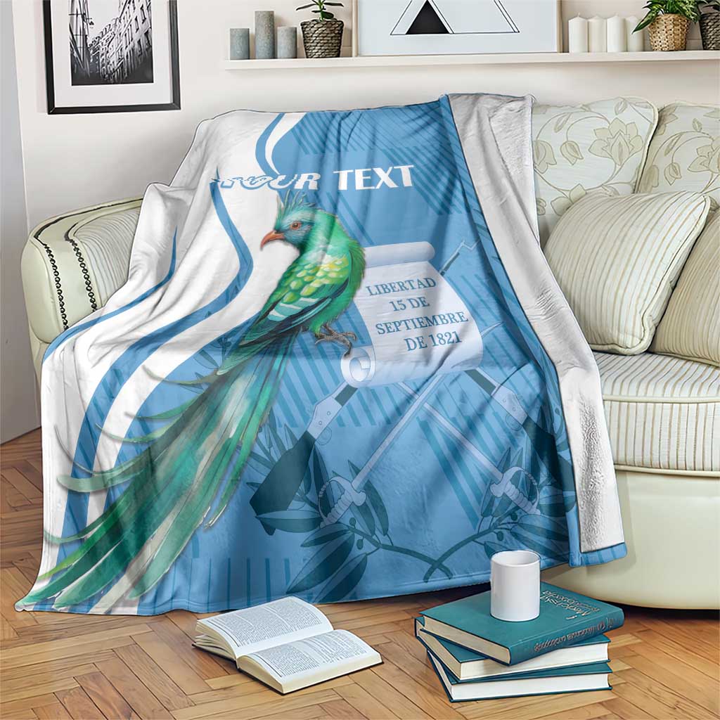 Blue throw blanket with quetzal bird graphic and 'YOUR TEXT' banner text