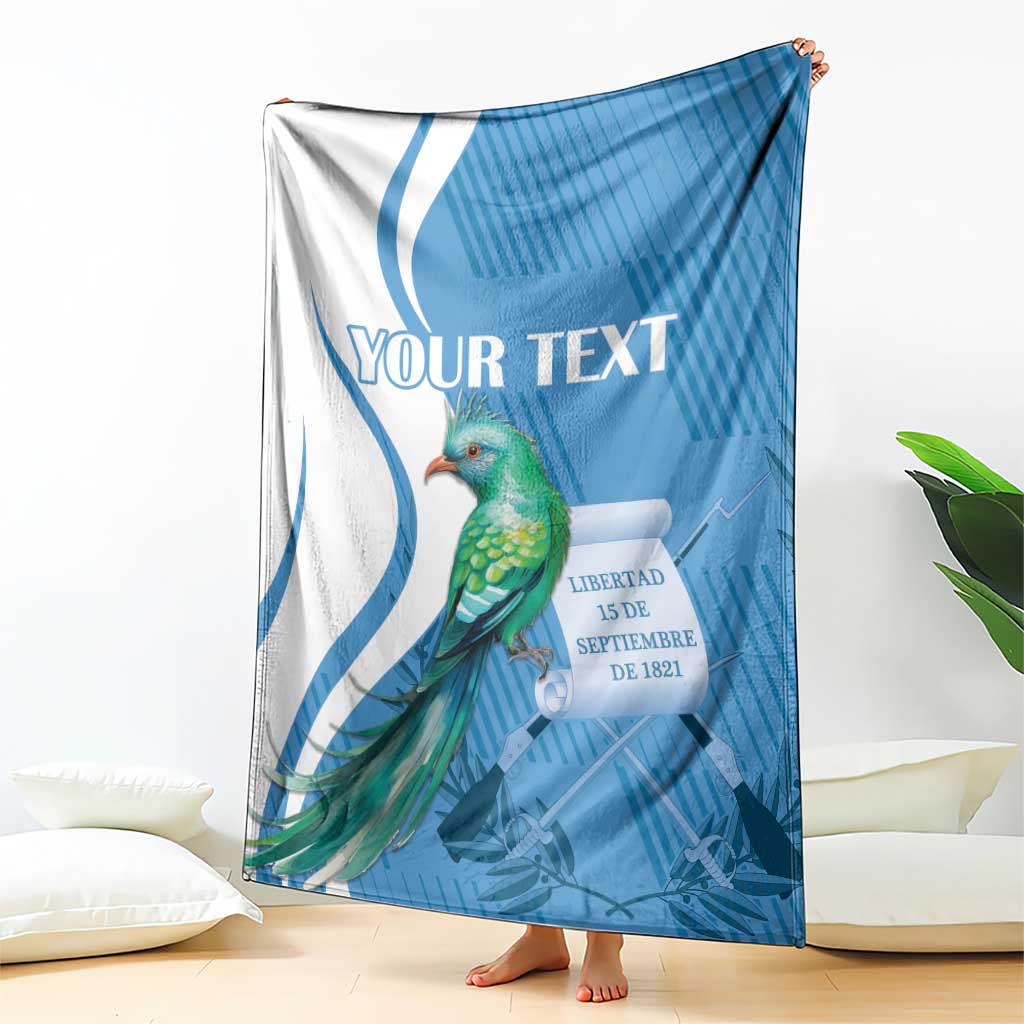 Blue and white personalized throw blanket with quetzal bird and decorative ribbon