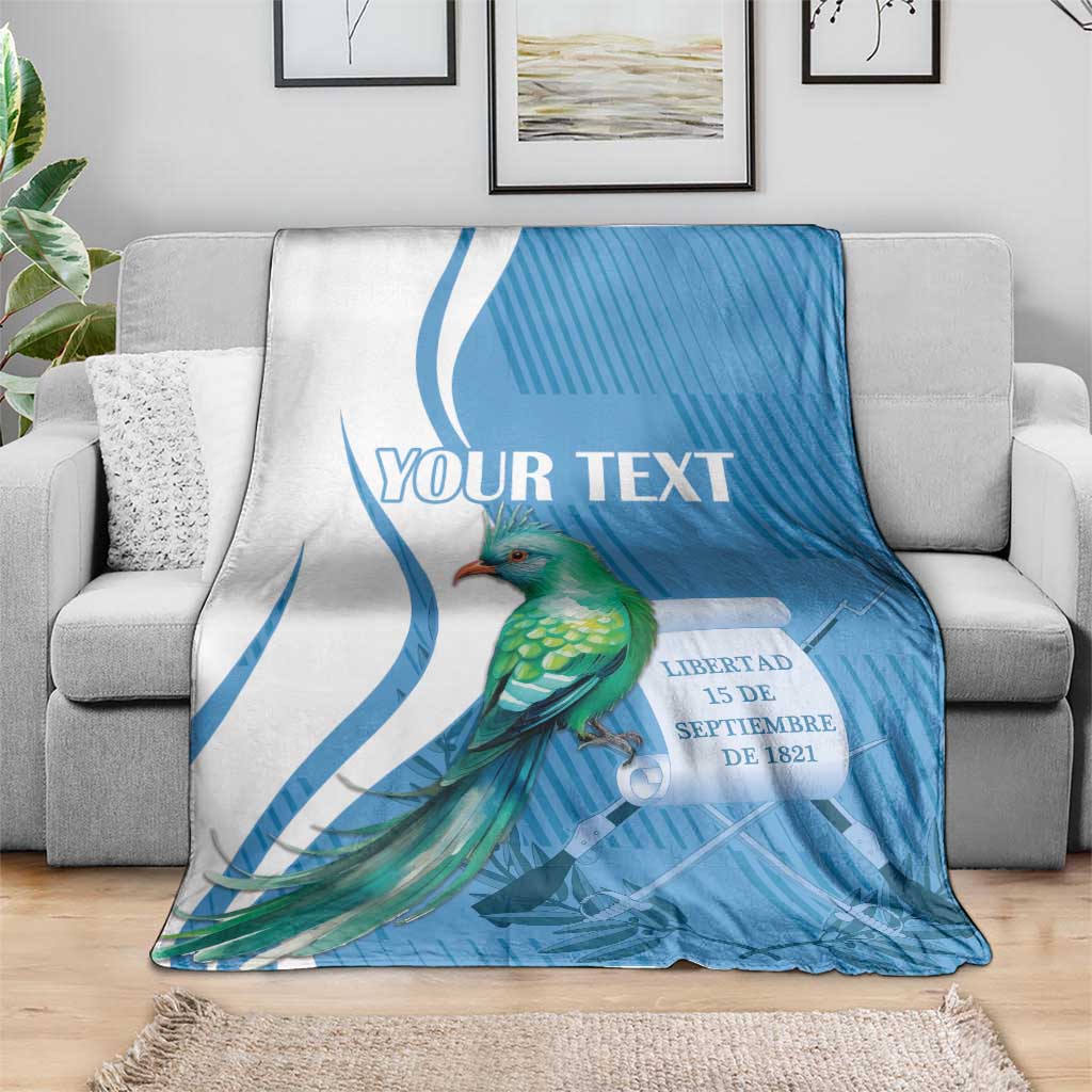 Blue throw blanket featuring quetzal bird and 'YOUR TEXT' title across top