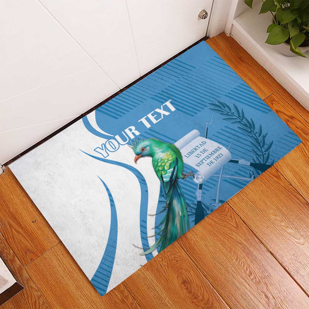Personalized blue rubber doormat with quetzal bird and blue wave leaf design