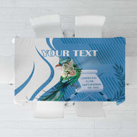 Personalized blue tablecloth design with “YOUR TEXT” and quetzal emblem artwork.