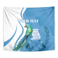 Close-up blue and white tapestry with green quetzal bird, 'YOUR TEXT', and date text