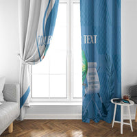 Personalized window curtains at a window, white panel with quetzal bird and blue panel