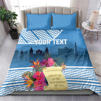 Blue bedding set with tropical flowers, city silhouette, and bold custom text across duvet