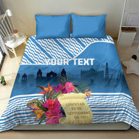 Blue duvet and pillows with tropical flower bouquet, custom text, and geometric stripes