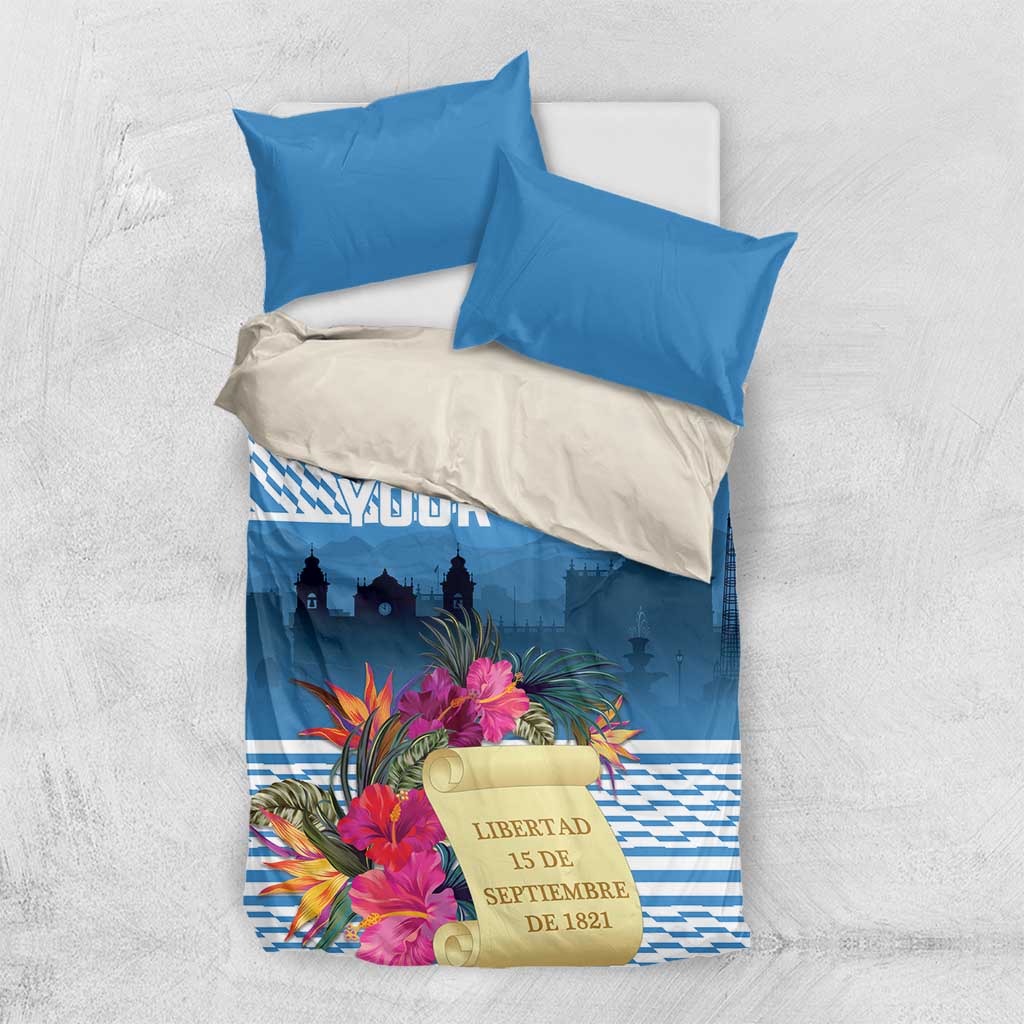 Blue bedding set featuring tropical flowers, custom text panel, and skyline print on duvet
