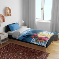 Blue personalized bedding set with tropical flowers, stripe pattern, and skyline print
