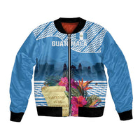 Blue bomber jacket with front zipper, black ribbed collar, tropical flower graphic
