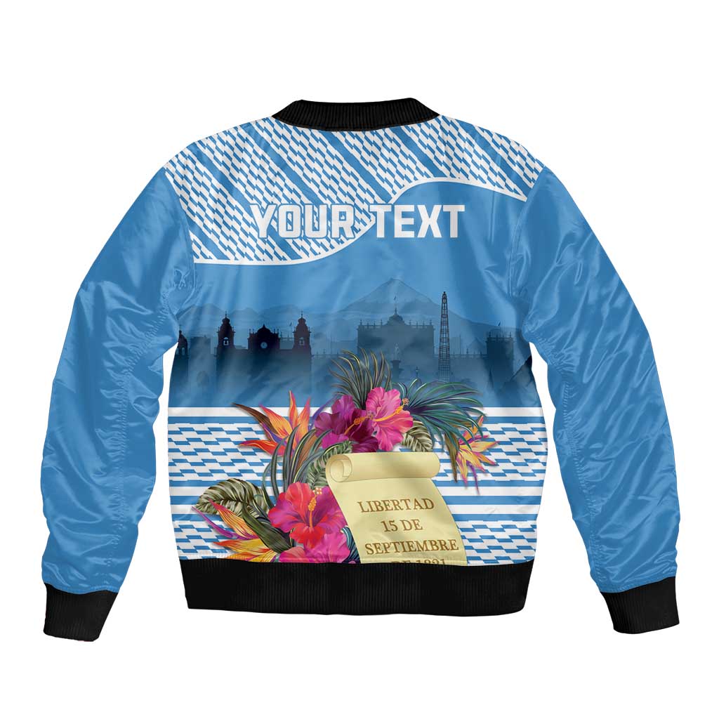 Blue bomber jacket with back graphic, black ribbed collar and hem, tropical flowers