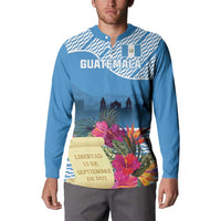 Blue button sweatshirt with Guatemala text, tropical flowers, and city skyline graphic