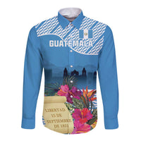 Blue long-sleeve button shirt with Guatemala-style tropical floral graphic on front