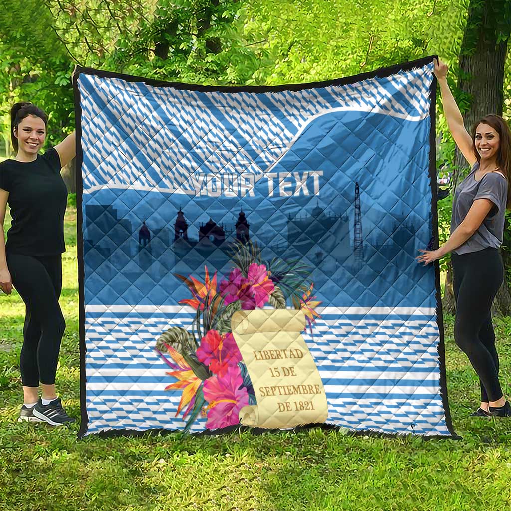 Blue quilt with quilted pattern, tropical flowers and castle skyline text