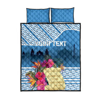 Blue quilt bed set with two square pillows; tropical flower print on front panel