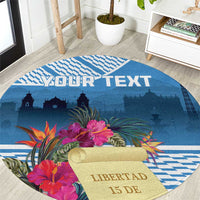 Blue round rug with tropical flowers, YOUR TEXT, and liberty skyline print.