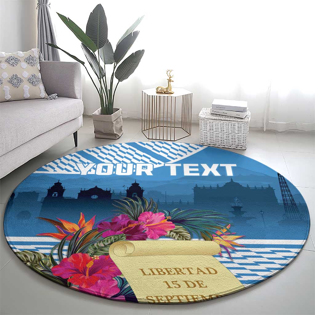 Blue round rug with tropical flowers, YOUR TEXT, and liberty skyline print from wider angle.