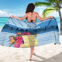 Blue striped sarong with tropical flowers and 'LIBERTAD 15 DE SEPTIEMBRE 1821' text.