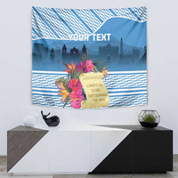 Blue Guatemala independence tapestry with tropical floral accents, scroll banner, and city skyline