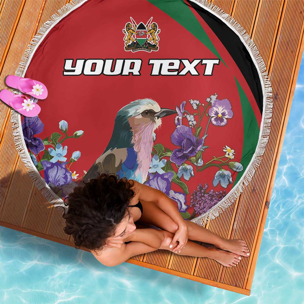 Round red beach blanket with fringe, multicolor border stripes, bird-and-flower design