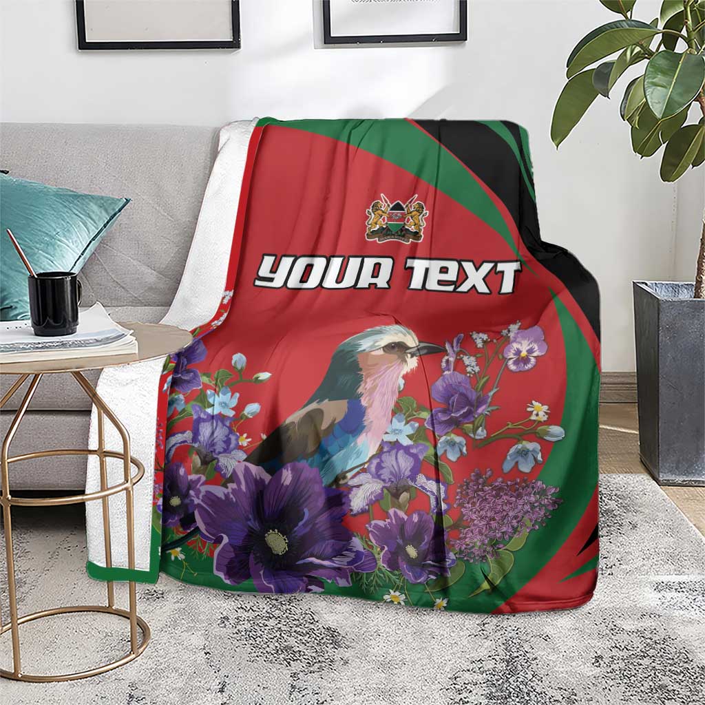 Personalized blanket on couch: bird illustration with purple flowers on red, green and black panels