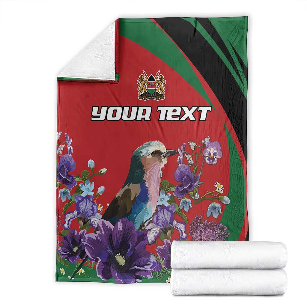 Personalized blanket folded: red, green, and black design with bird and purple flowers; custom text