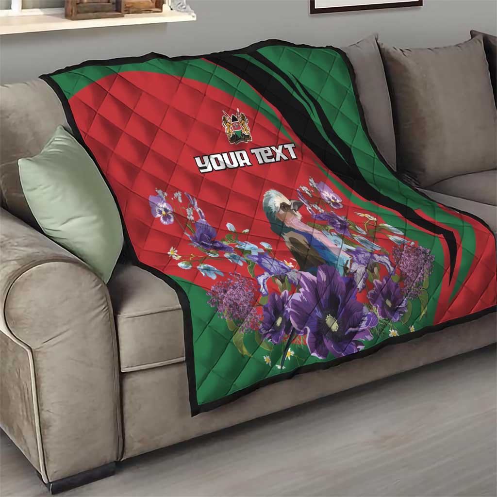 Personalized quilt on sofa with red-and-green swirl edges, purple flower artwork, and “YOUR TEXT”