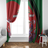 Red roller window curtain with green panels and purple floral bird print, custom text