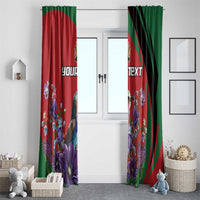 Two roller window curtains with red and green bands and purple floral bird artwork