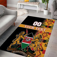 Black area rug with Kenya coat of arms, lions and shield over multicolor Kente border