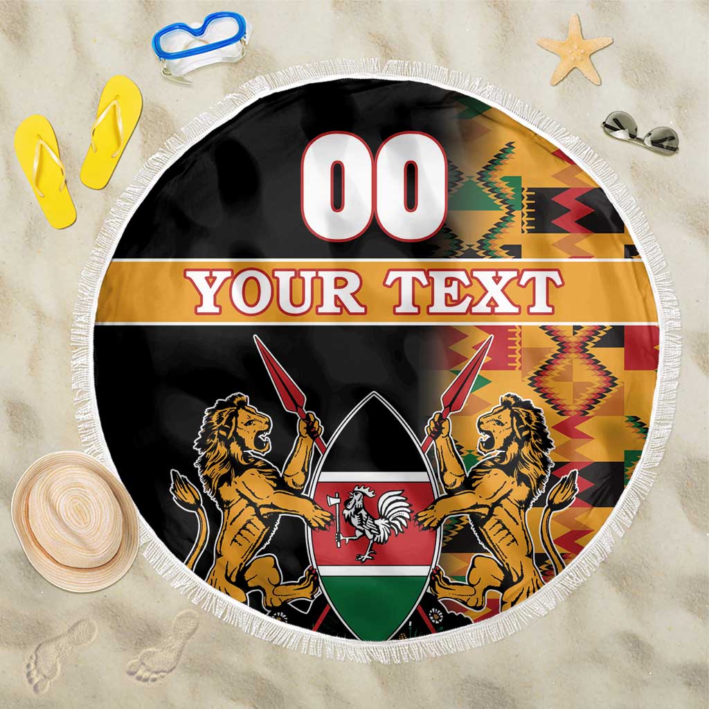 Round beach blanket with fringed edge, black coat of arms and Kente pattern bands