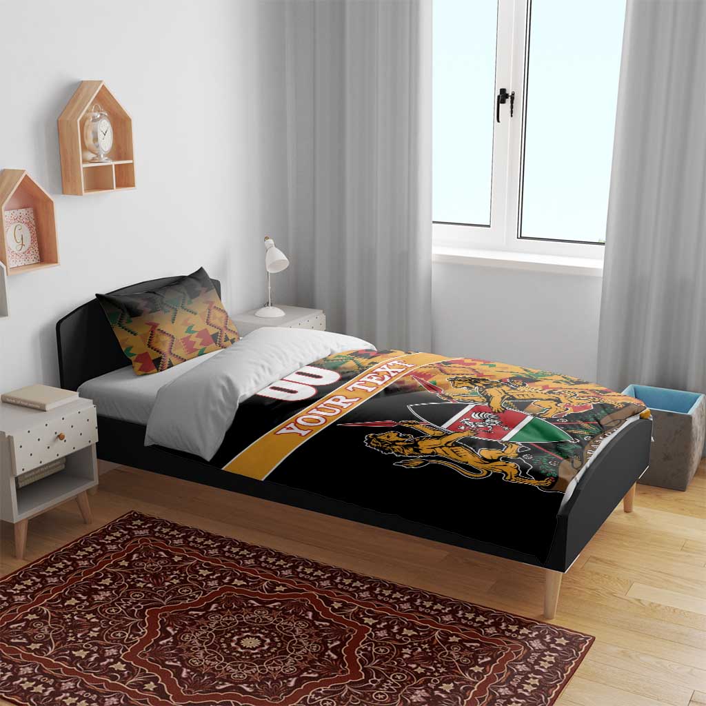 Black bedding set with Kente patterned stripe and Harambe crest graphic on duvet
