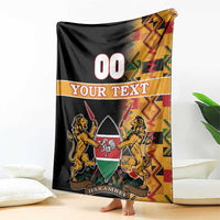 Black Kenya coat of arms blanket with Kente border, lion crest and HARAMBEE