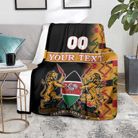 Black Kenya coat of arms blanket with Kente stripes, lion crest and HARAMBEE
