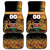Pair of black car floor mats with Kente zigzag pattern and Kenya coat of arms graphics