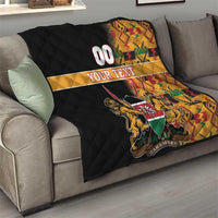 Custom quilt on couch with black quilting, kente pattern trim, 00 YOUR TEXT, lions shield