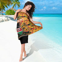 Black custom sarong with colorful kente zigzag pattern and lion crest emblem