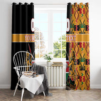 Window curtain pair with grommet-style top, black and kente-pattern fabric, lion crest