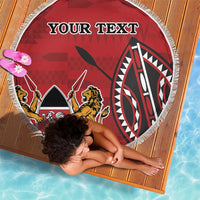 Red round beach blanket with fringe border and lion-and-mask emblem, custom text.