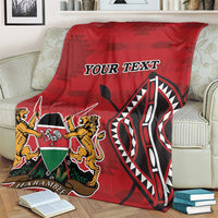 Red Kenya coat of arms blanket on couch with 'YOUR TEXT' and Harambe shield graphic