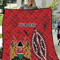 Red quilt with quilted diamond stitching and Kenya coat of arms emblem with “YOUR TEXT”