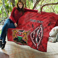 Red quilt with quilted diamonds, Kenya coat of arms emblem and “YOUR TEXT” text print