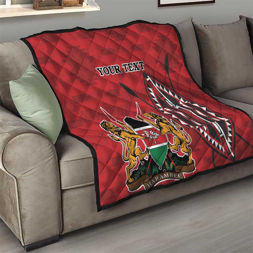 Red quilt with quilted diamonds, Kenya coat of arms emblem and “YOUR TEXT” on sofa