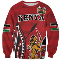 Red crewneck sweatshirt with Kenya graphic, lion emblem, and flag accents