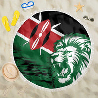 Round Kenya flag beach blanket with lion head graphic, green and red, white fringe