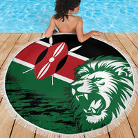Round Kenya flag beach blanket featuring lion head, green-and-red design with white fringe