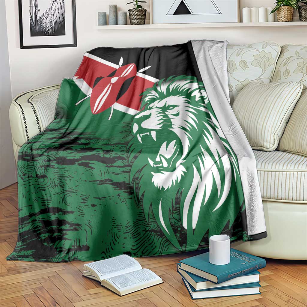 Green lion head blanket draped on sofa with red flag emblem and black corner