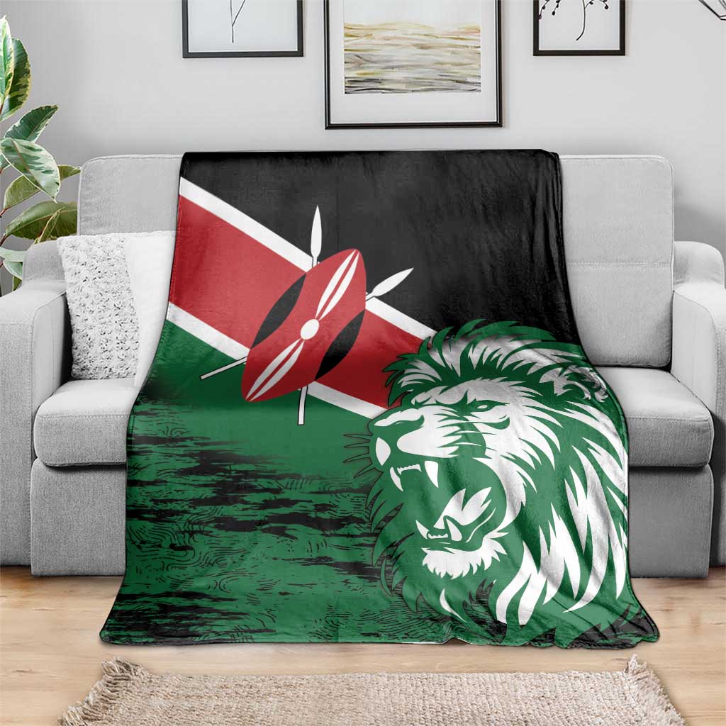 Green lion head blanket on gray sofa with red flag emblem and white lion face