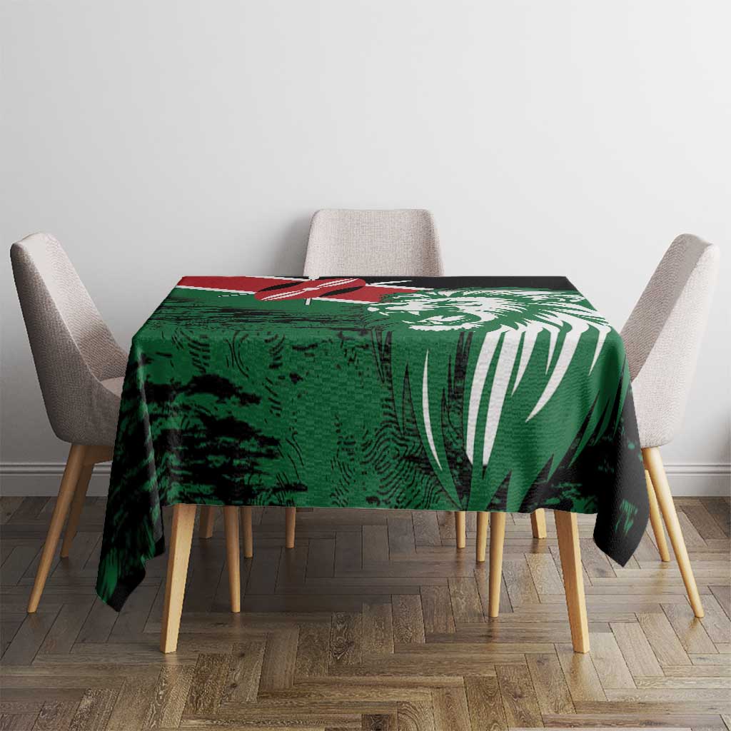 Green and black tablecloth featuring Kenya lion head and flag-style emblem, on square table.