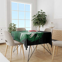 Green and black Kenya lion head tablecloth with flag-style pattern on dining set.